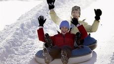 Two people with snowtubing at Wintergreen Resort in Virginia, USA
